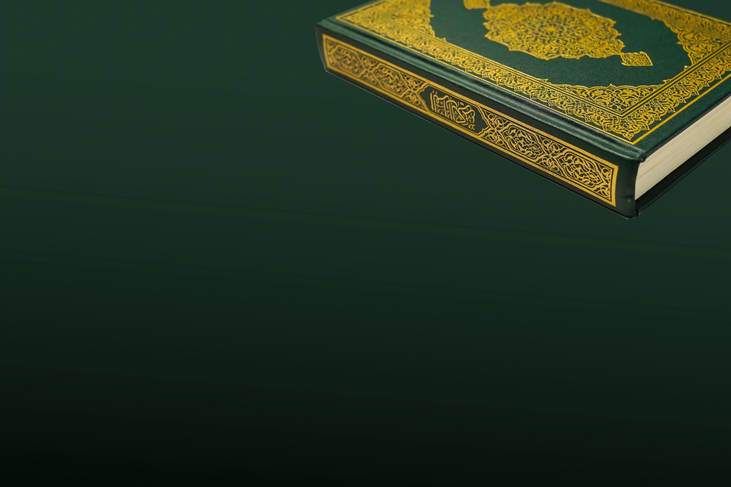 Holy Quran with Arabic calligraphy and prayer beads on dark background